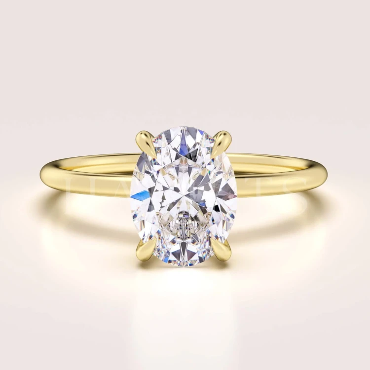 bague-fiancailles-solitaire-forever-moissanite-1_5ct-taille-ovale-or-jaune-hariets.jpg