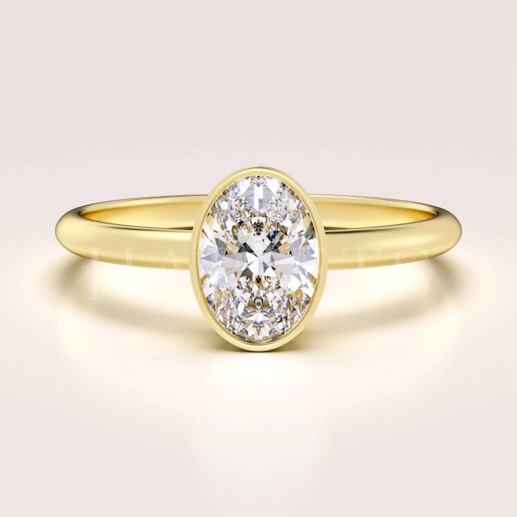 bague-de-fiancailles-bezel-moissanite-0-5ct-taille-ovale-or-jaune-pure-hariets.jpg