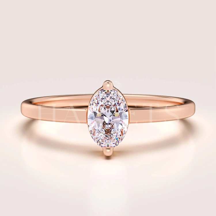 bague-fiancailles-petit-moissanite-0-5ct-taille-ovale-or-rose-mystique-hariets.jpg