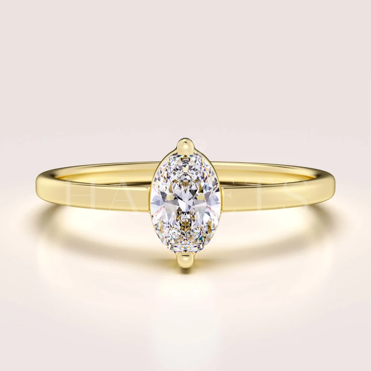bague-fiancailles-petit-moissanite-0-5ct-taille-ovale-or-jaune-mystique-hariets.jpg