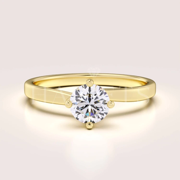 bague-fiancailles-solitaire-bloom-moissanite-0-6ct-taille-brillant-or-jaune-hariets.jpg