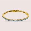 bracelet-tennis-avec-moissanites-bleues-3mm-argent-dore-hariets.jpg