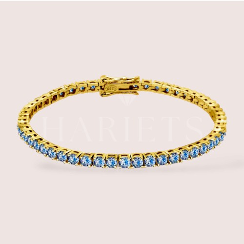 bracelet-tennis-avec-moissanites-bleues-3mm-argent-dore-hariets.jpg