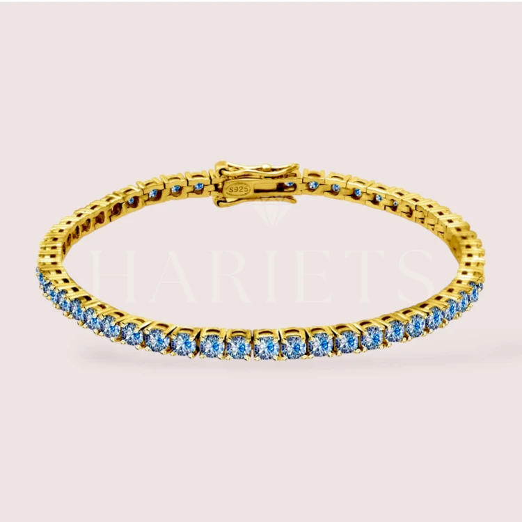 bracelet-tennis-avec-moissanites-bleues-3mm-argent-dore-hariets.jpg