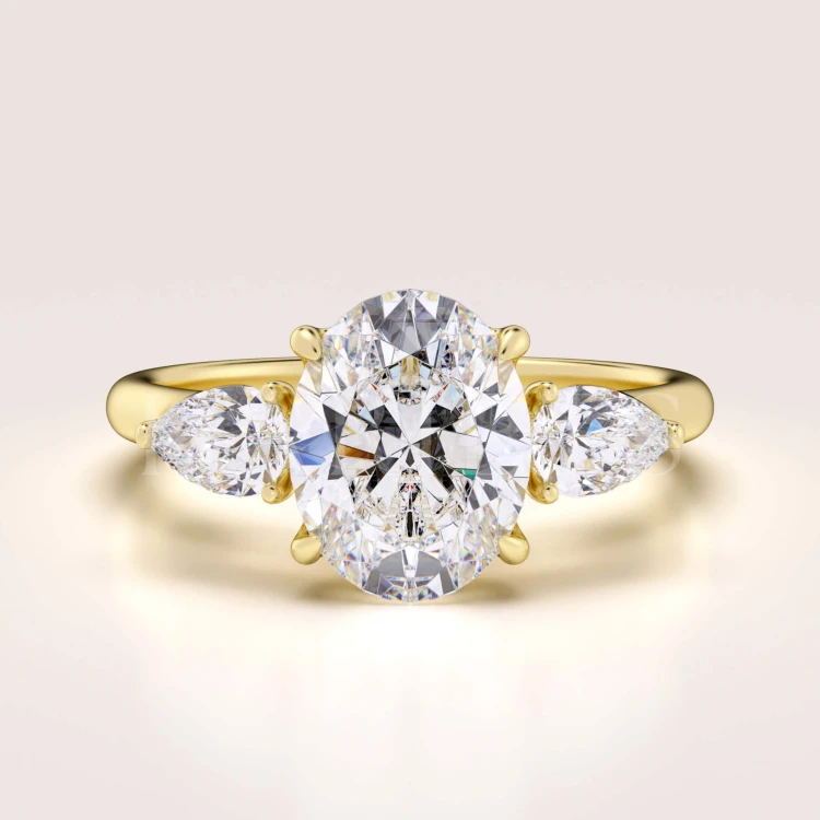 bague-de-fiancailles-trinity-seraphina-diamant-de-laboratoire-2ct-pierre-centrale-taille-ovale-or-jaune-hariets.jpg
